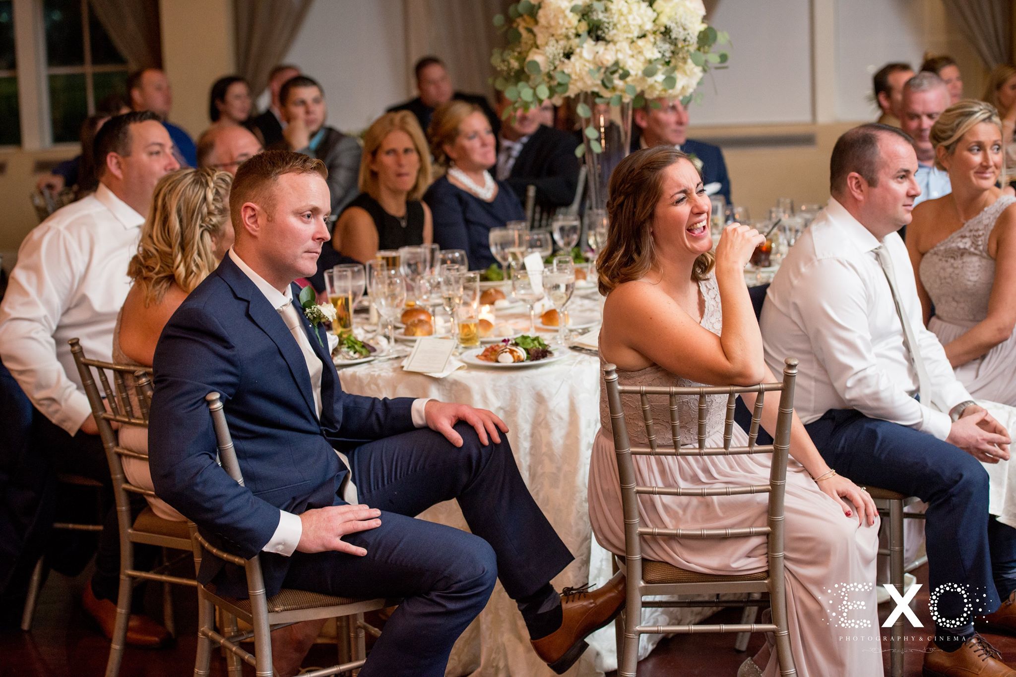 wedding guests laughing at toasts during Heritage Club at Bethpage wedding reception
