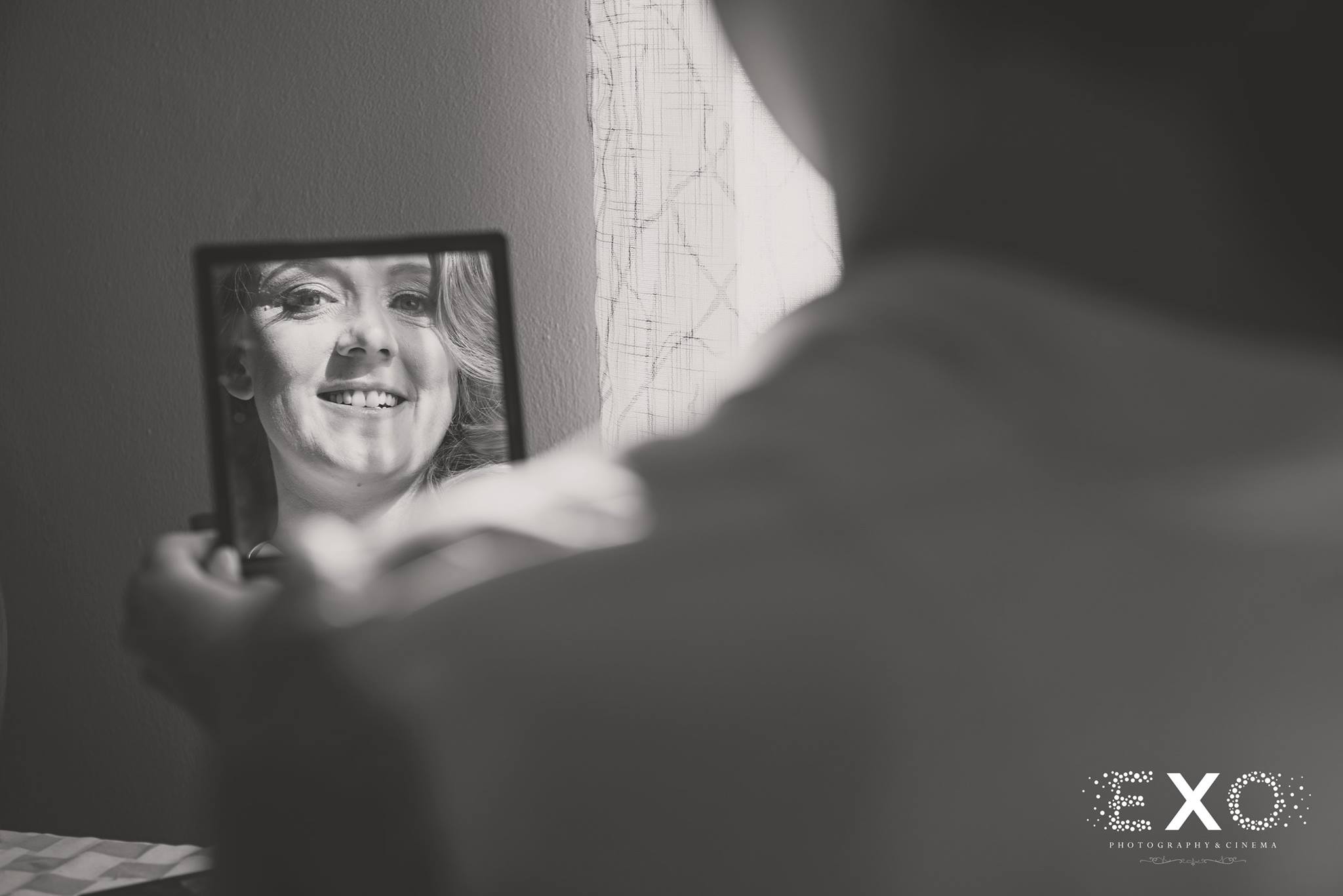 black and white mirrored shot of bride before Heritage Club at Bethpage ceremony