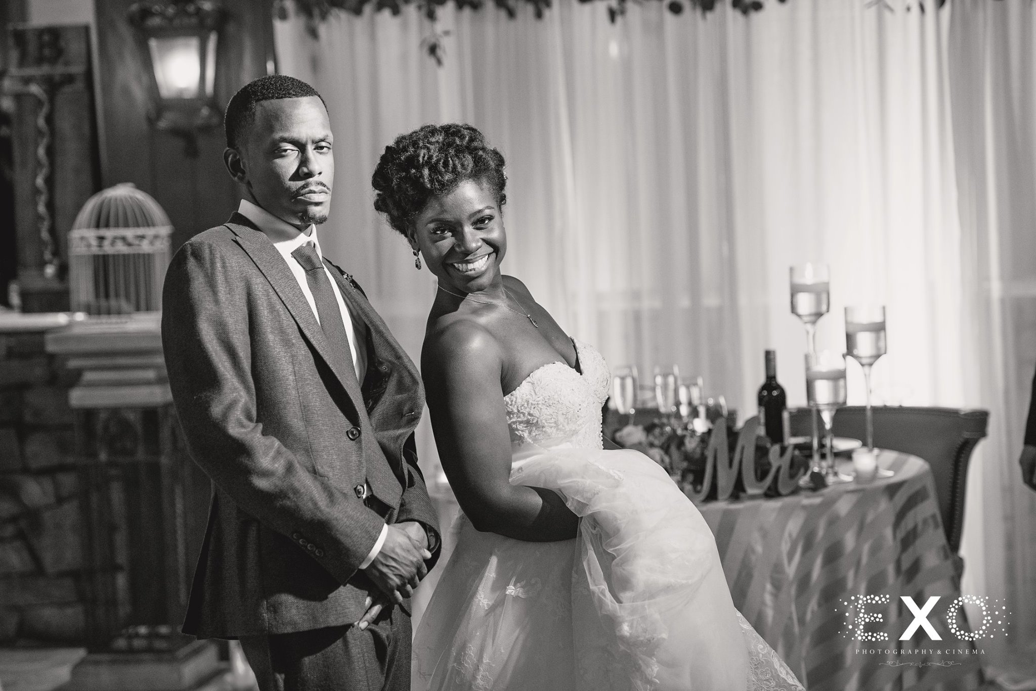black and white image of bride and groom at reception