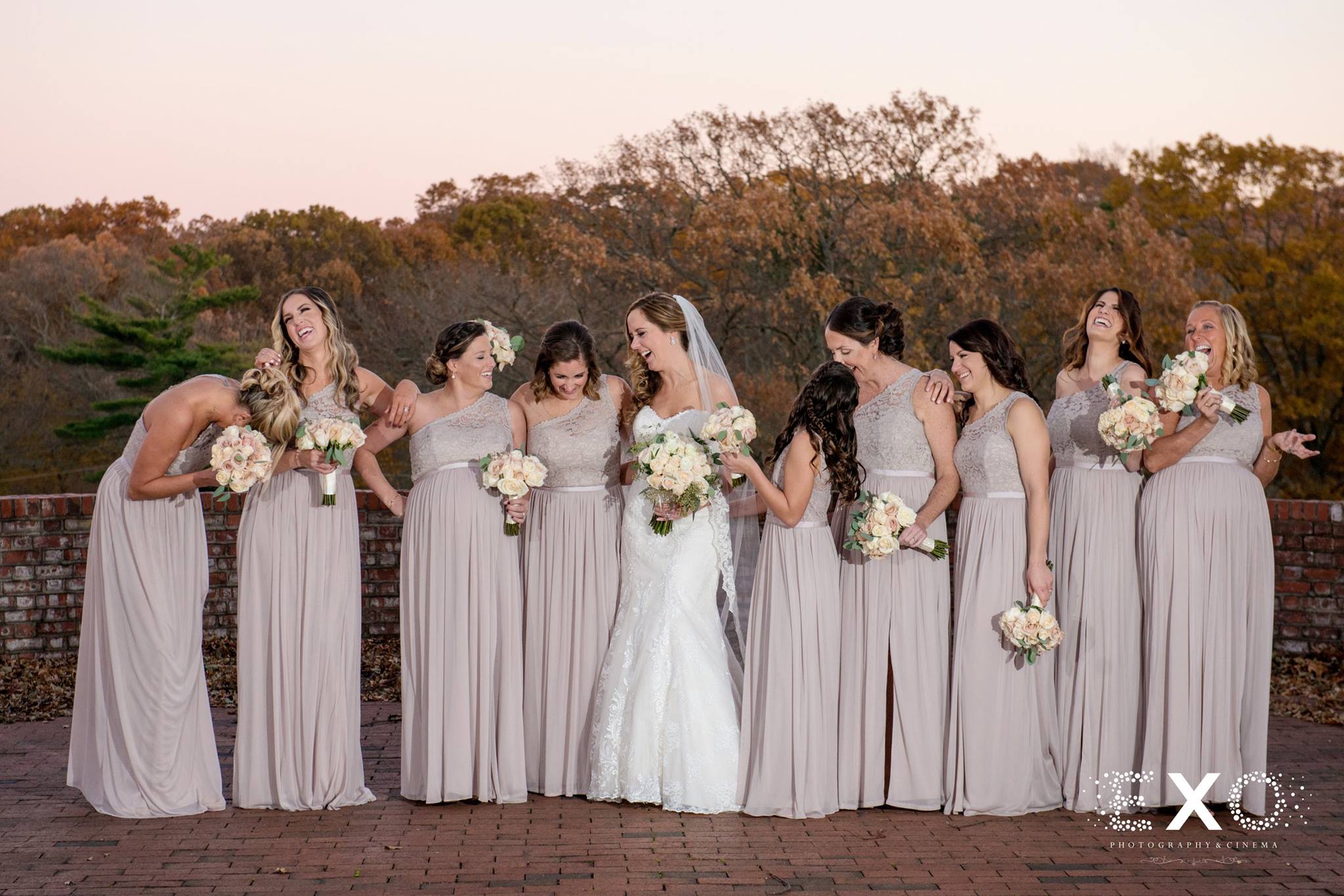 bride wearing blossom brides gown designed by maggie sorttero and bridesmaids wearing davids bridal gowns