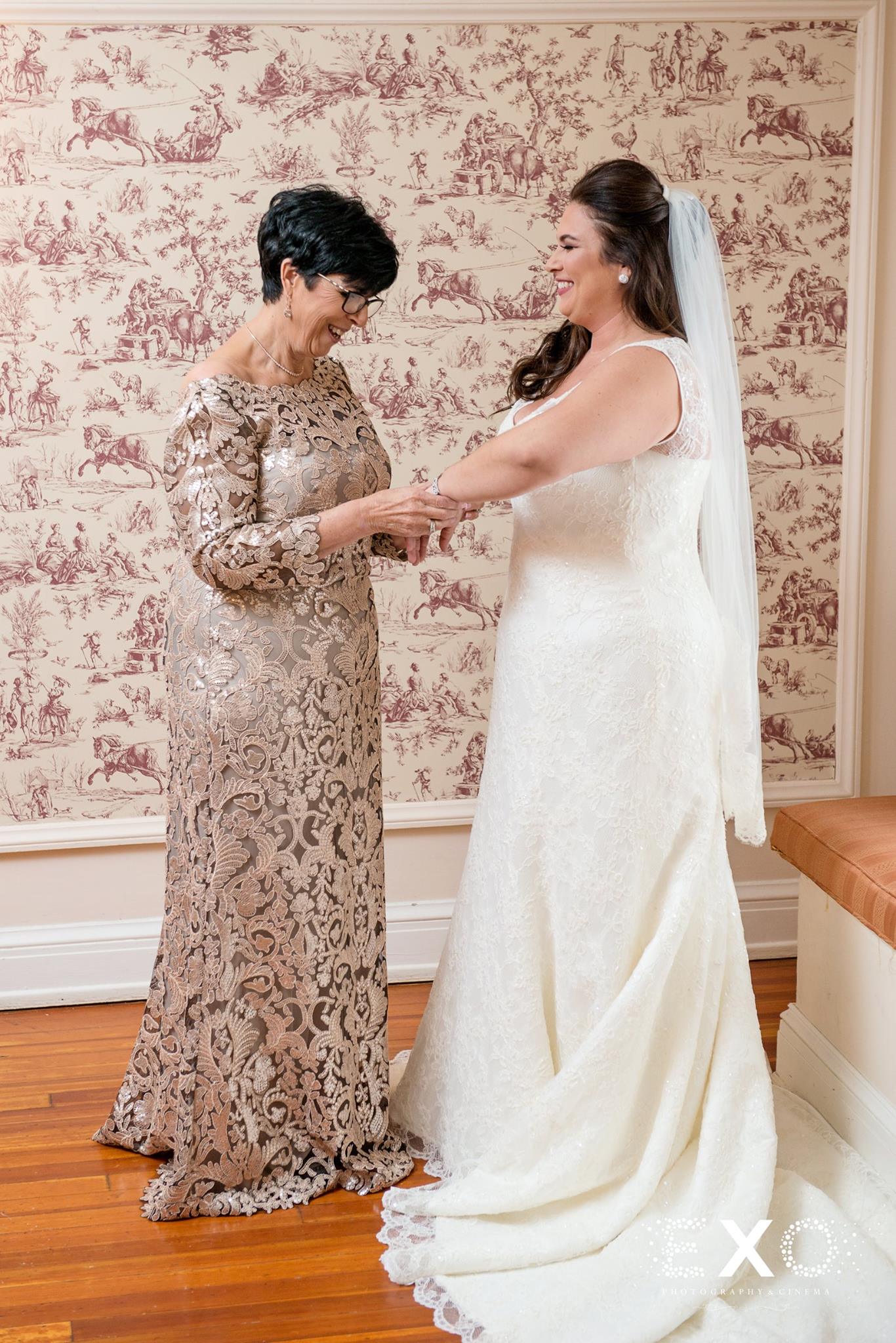 bride and mother getting ready wearing kleinfeld bridal gown and bridal reflections of massapequa dress