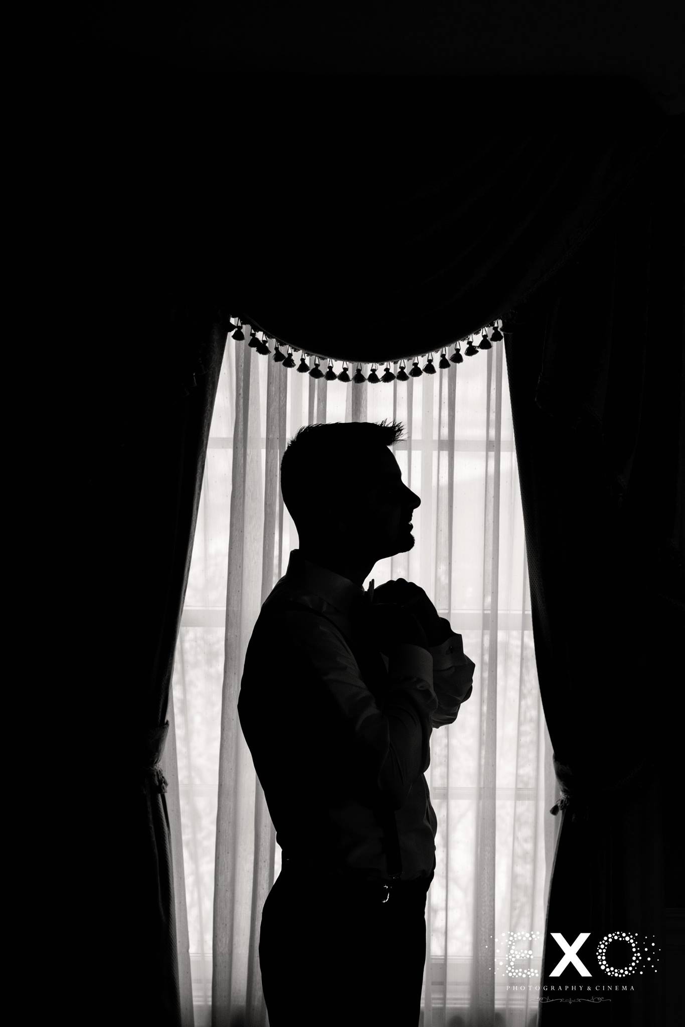 black and white silhouette shot of groom at Royalton at Roslyn mansion