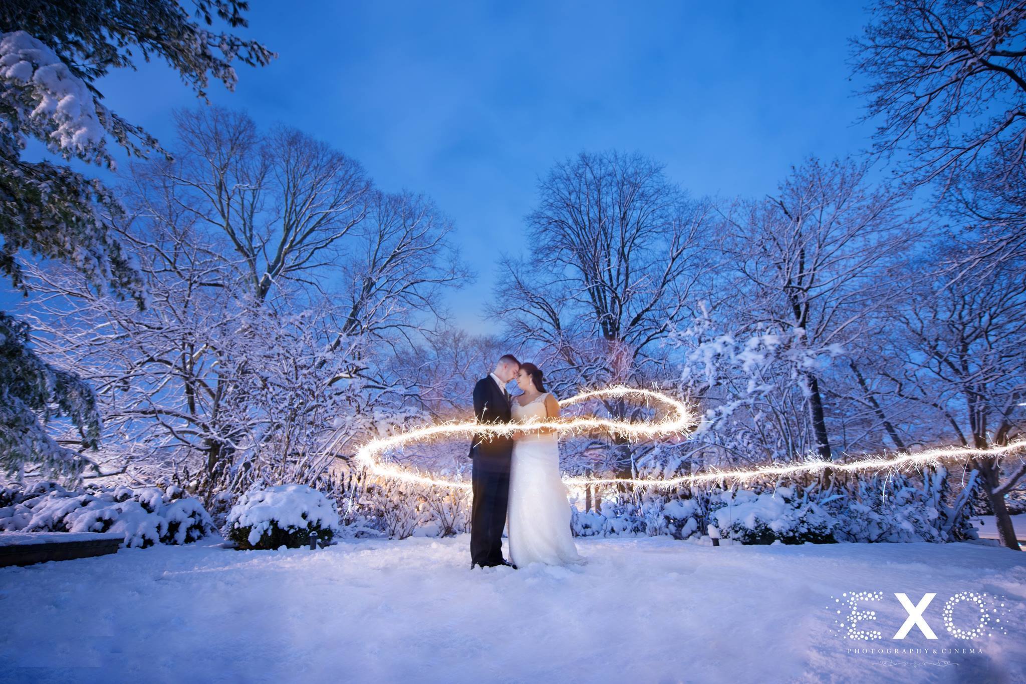 winter wedding shot with sparkler effect at Royalton at Roslyn mansion