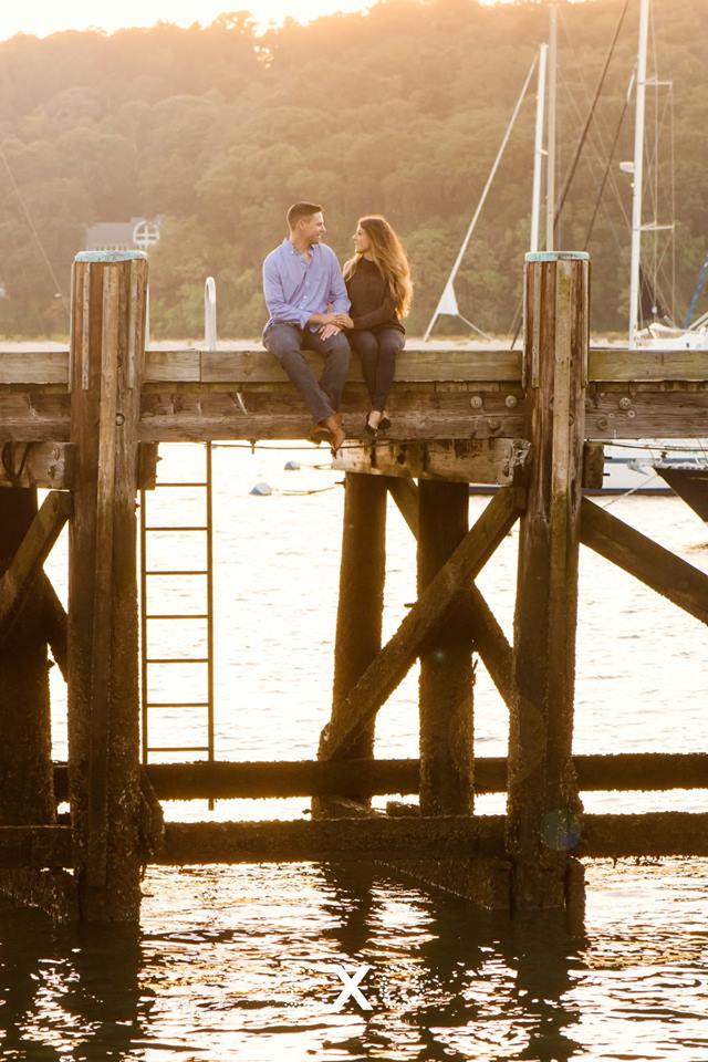 Couple sitting on the dock at Northport Village