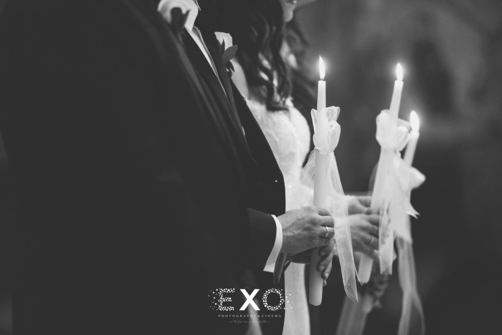 Bride and groom holding candles