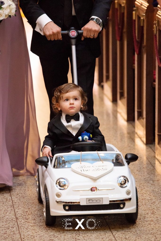 Ring bearer in just married car