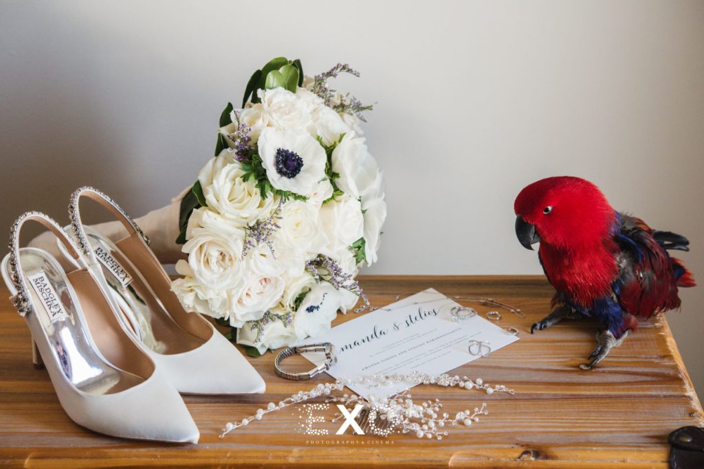 Bride's bouquet, shoes, jewelry, and invitation at The Mansion at Oyster Bay