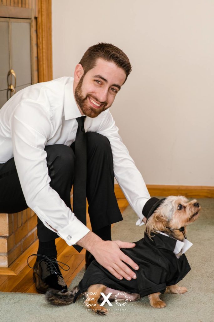 Groom and dog at The Mansion at Oyster Bay