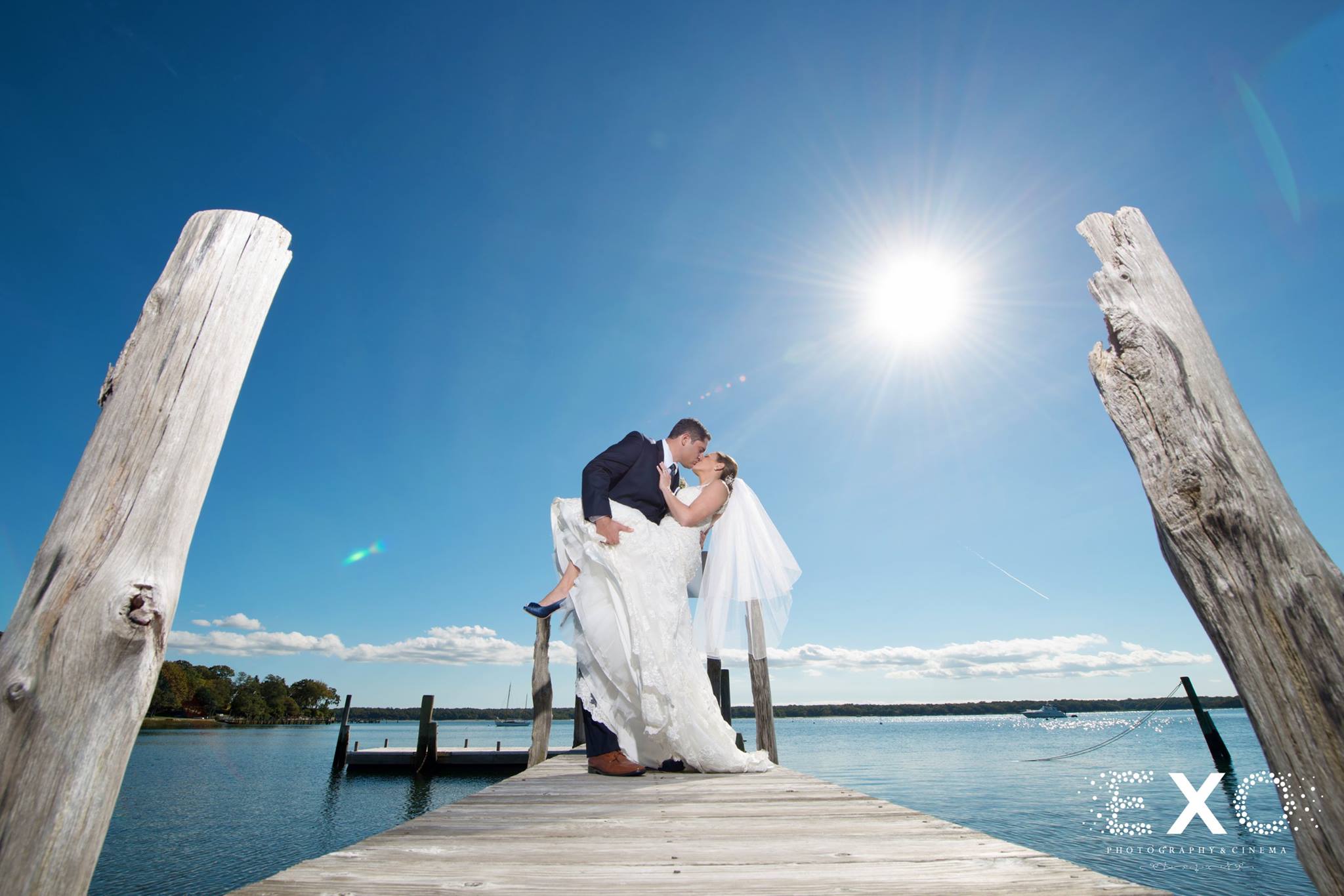 Bride and groom at the dock of The Ram's Head Inn