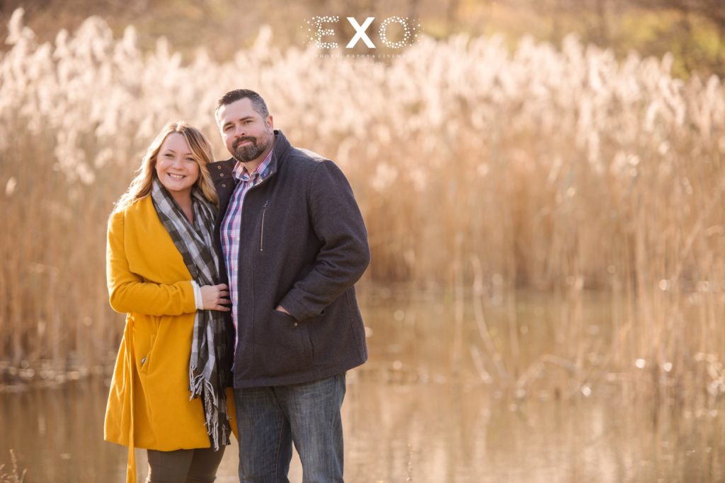 couple in love on corn field by the water engaged