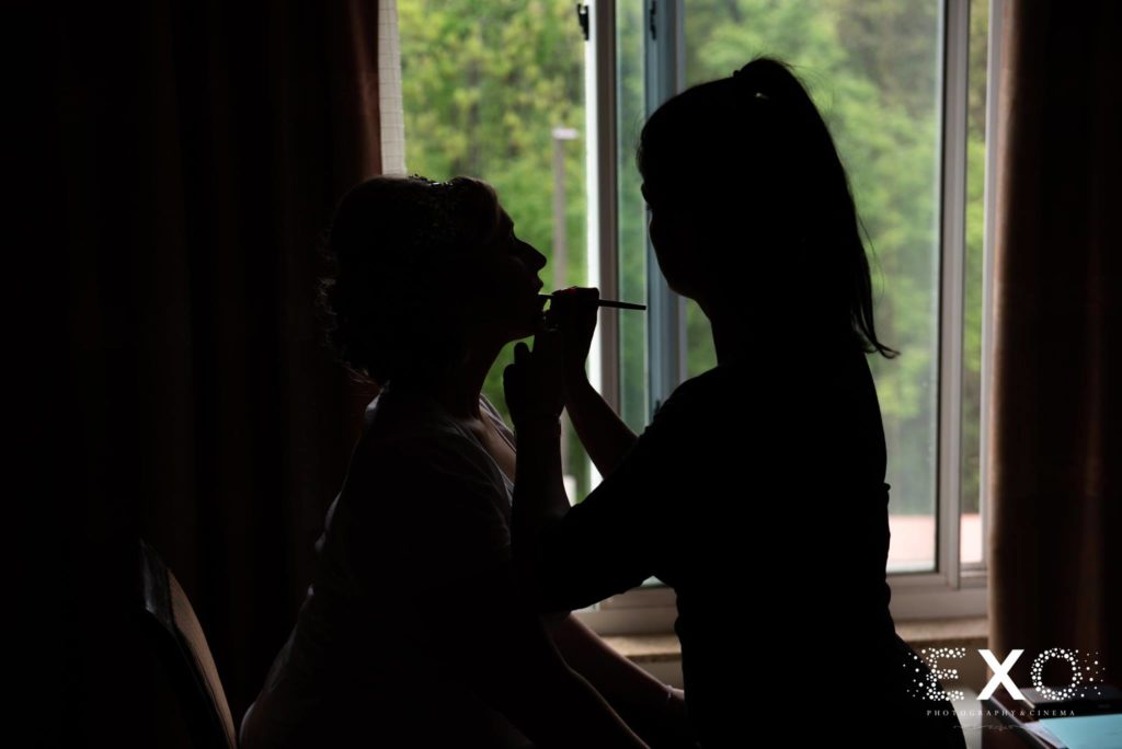 Bride getting her makeup done at The Mansion at Oyster Bay
