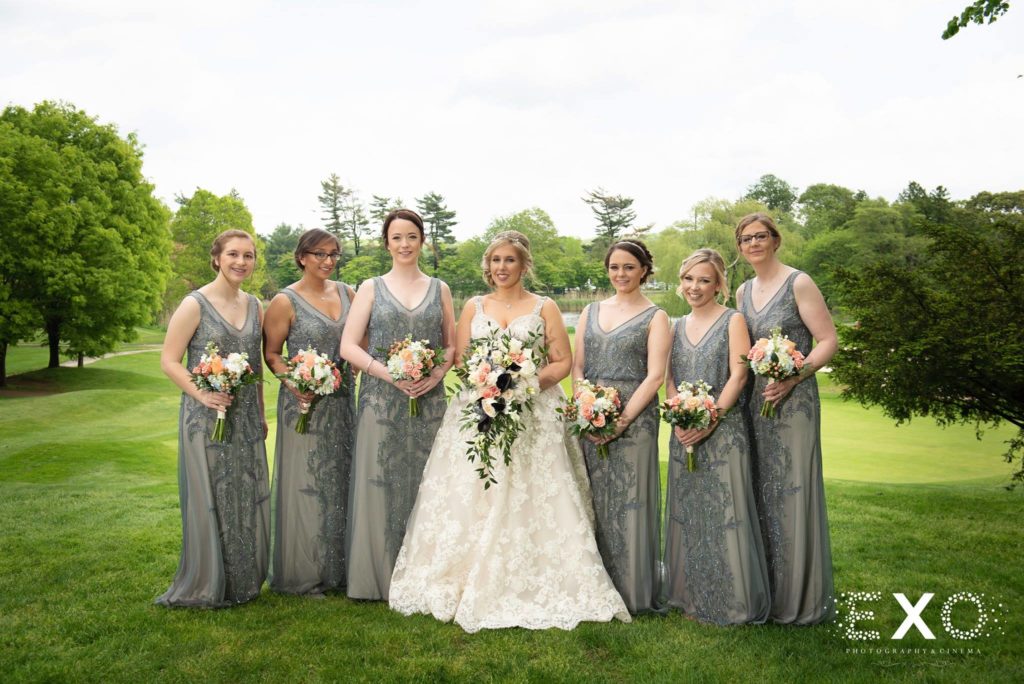 bride and bridesmaids posing with bouquets