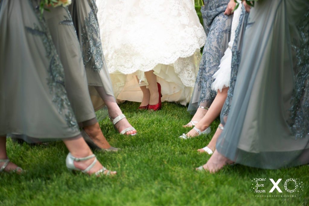 brides shoes among bridesmaids shoes