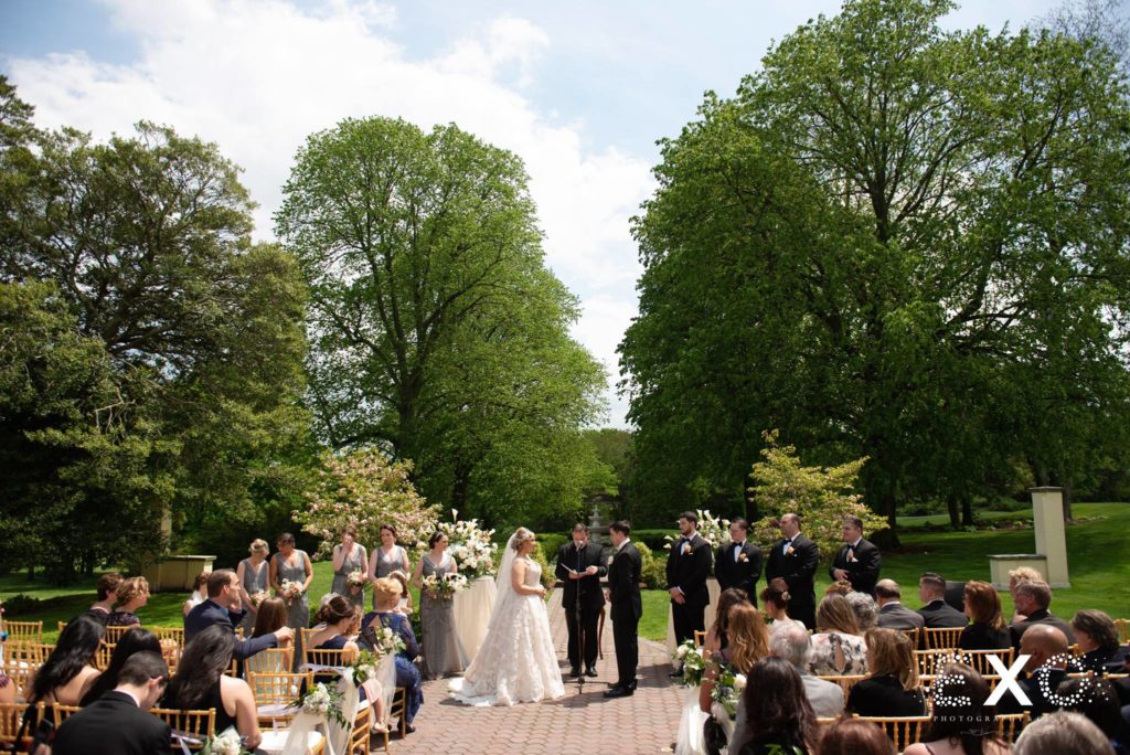 bride and groom exchanging vows at The Mansion at Oyster Bay