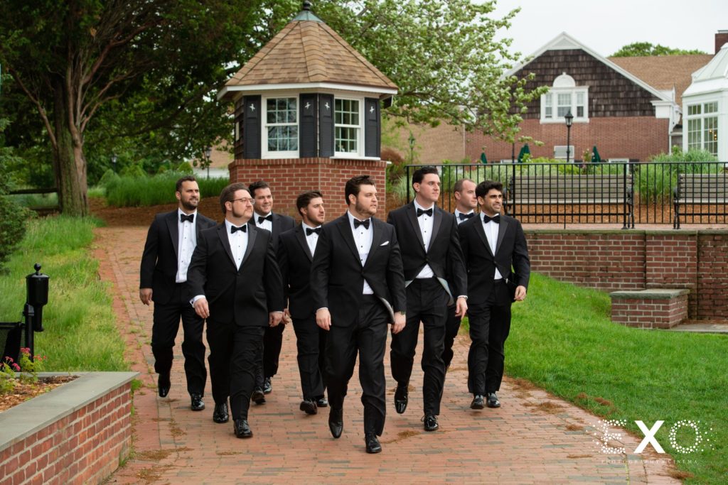 groom and groomsmen rolling up in style