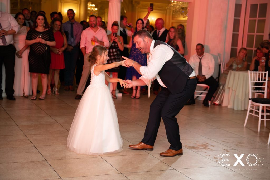 groom dancing with his daughter at Lombardi's on the Bay