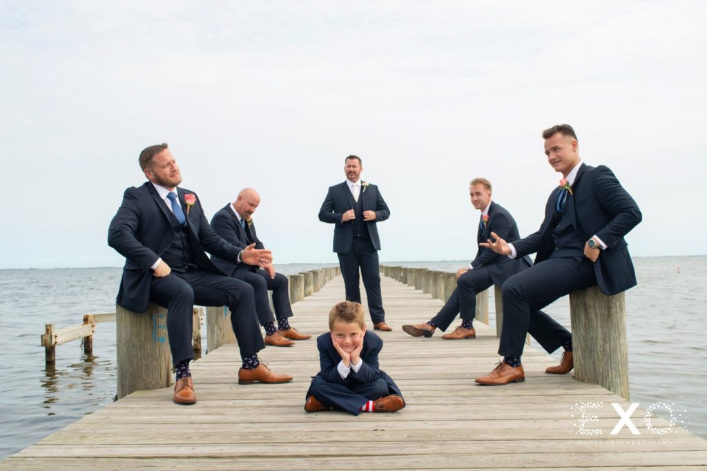 groomsmen posing on the dock at Lombardi's on the Bay