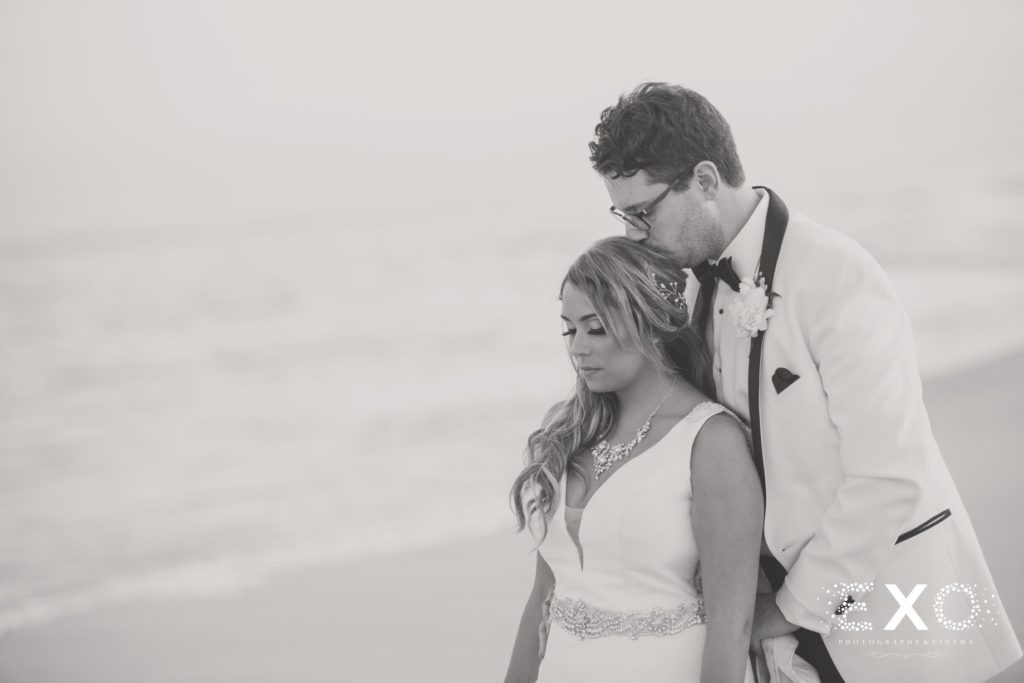 bride and groom on the beach at Oceanbleu