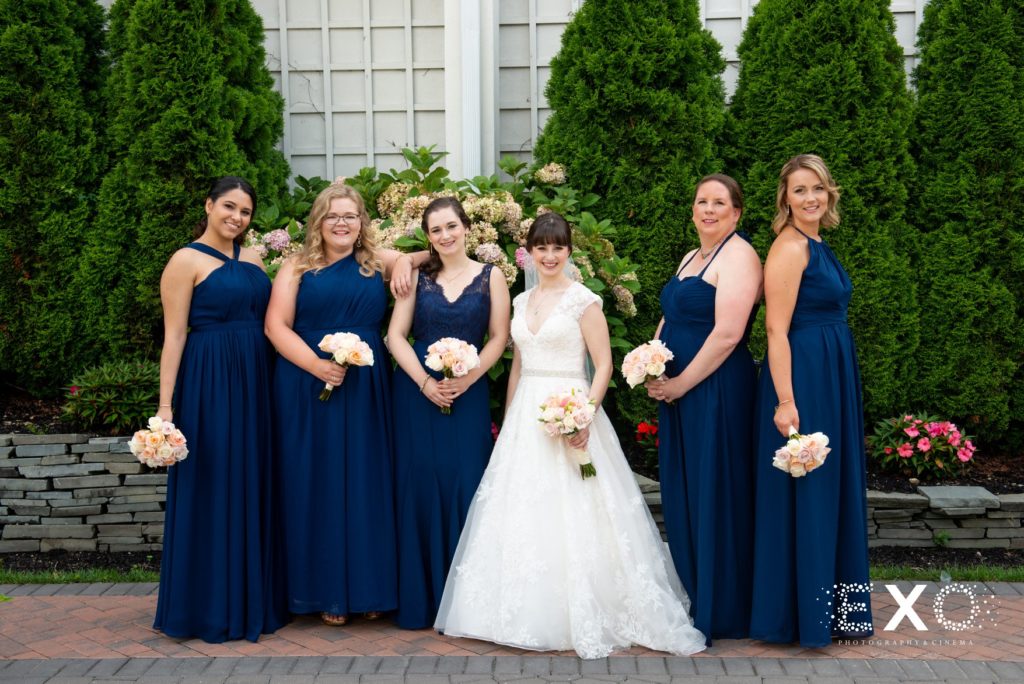 Bride and bridesmaids outside Fox Hollow
