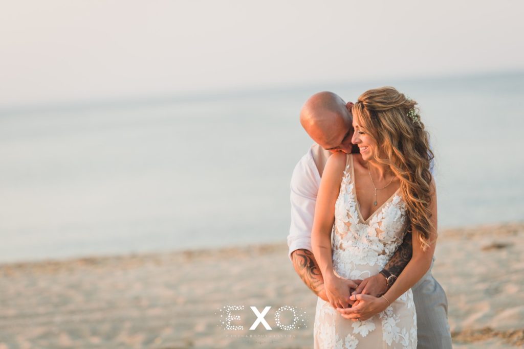 glowing bride and groom on the beach at Pavilion at Sunken Meadow