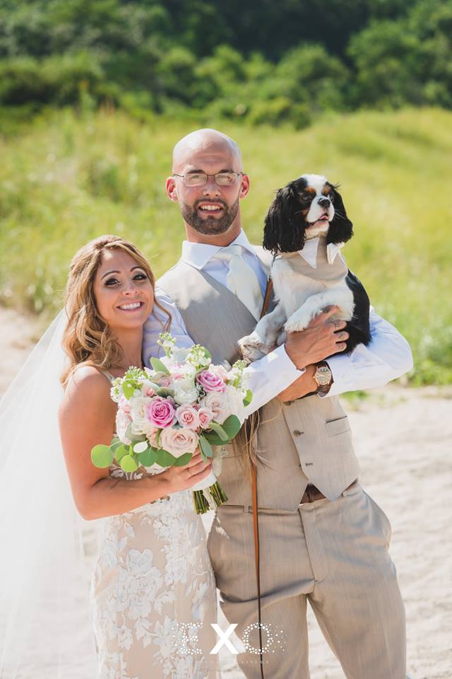 bride and groom with their dog at Pavilion at Sunken Meadow