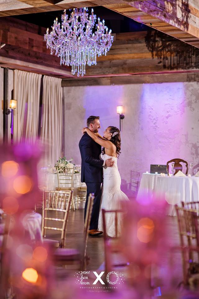 Bride and groom dancing alone in ballroom at The Loft at Bridgeview Yacht Club