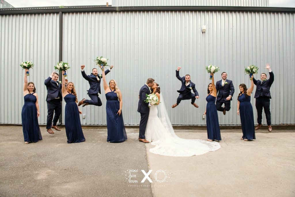 Bride and groom with silly bridal party at The Loft at Bridgeview Yacht Club