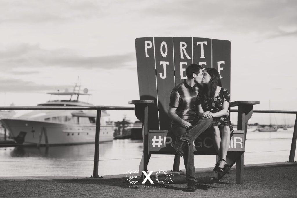 couple sitting in Port Jeff chair at Port Jefferson Harbor