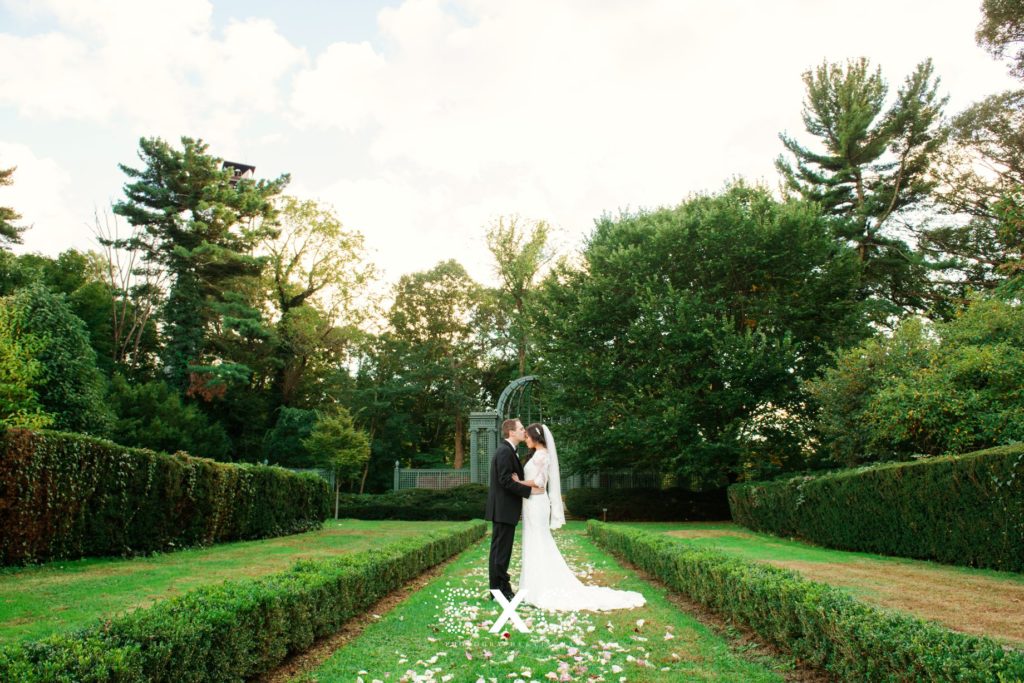 bride and groom in the garden at North Shore Country Club