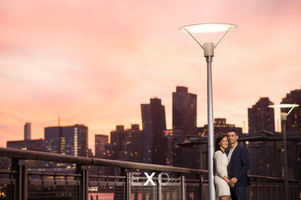 couple standing under a lamp post