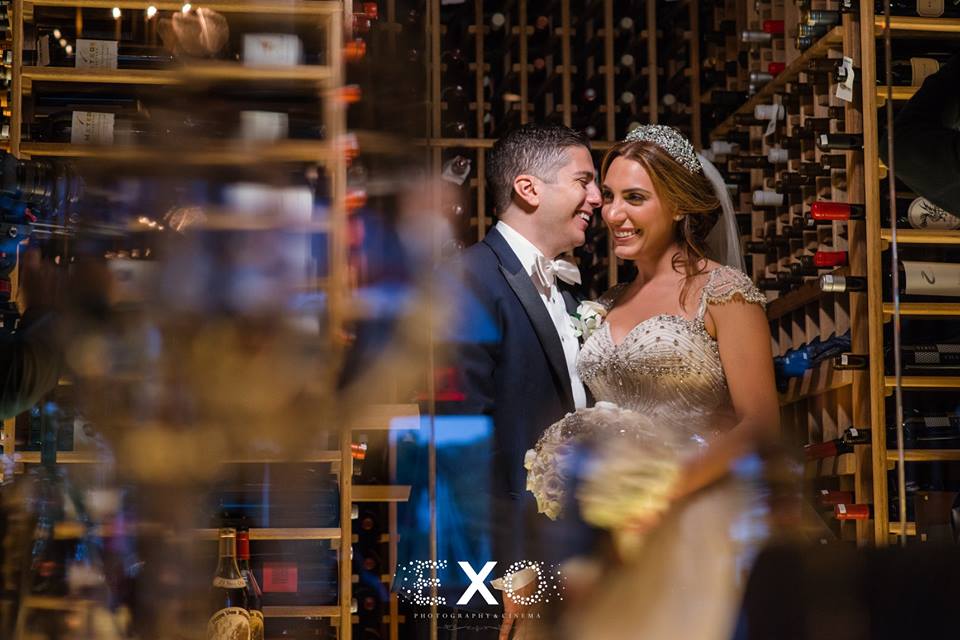 bride and groom in wine cellar at Harbor Club at Prime
