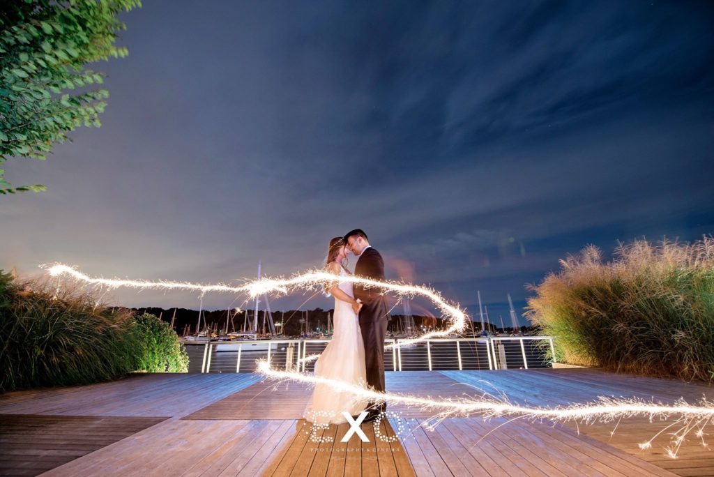 bride and groom outside in lights at Harbor Club at Prime