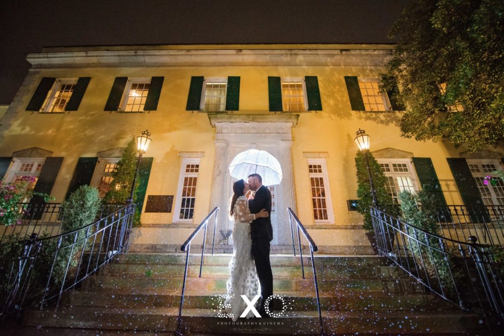 bride and groom kissing outside The Mansion at Oyster Bay