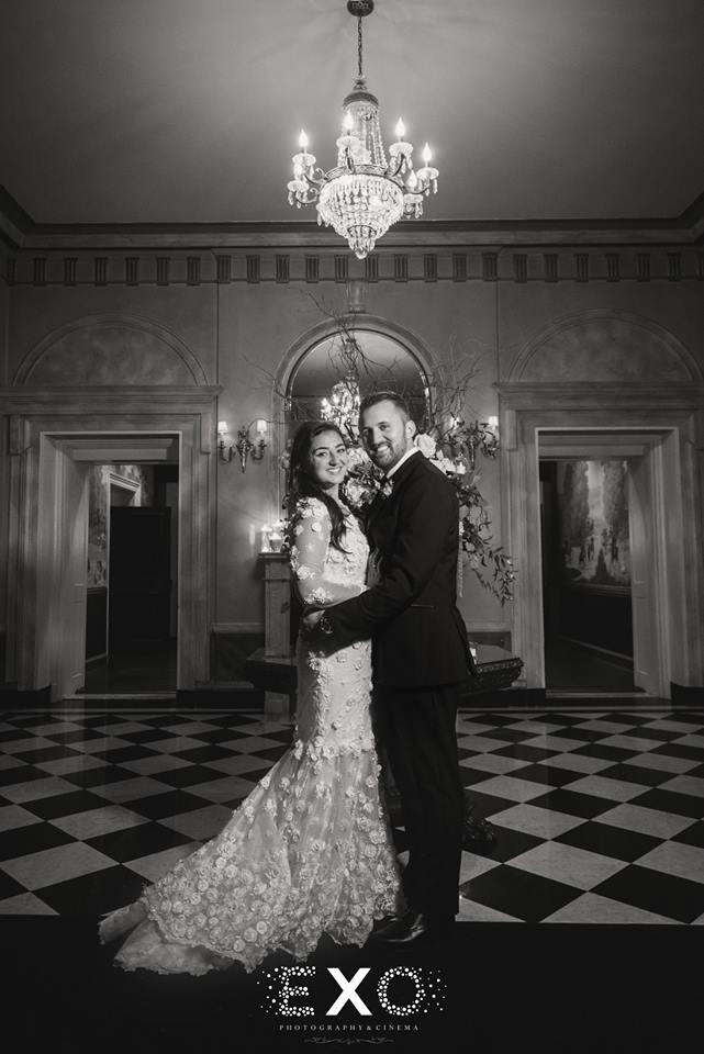 bride and groom posing in black and white at The Mansion at Oyster Bay