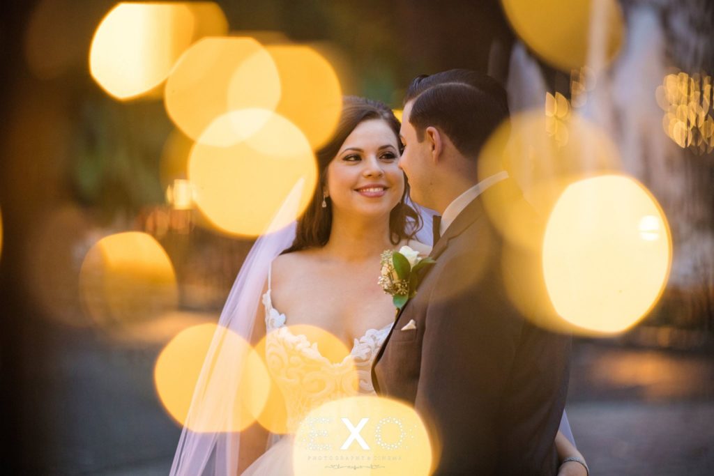Bride and groom with yellow lights at Fox Hollow
