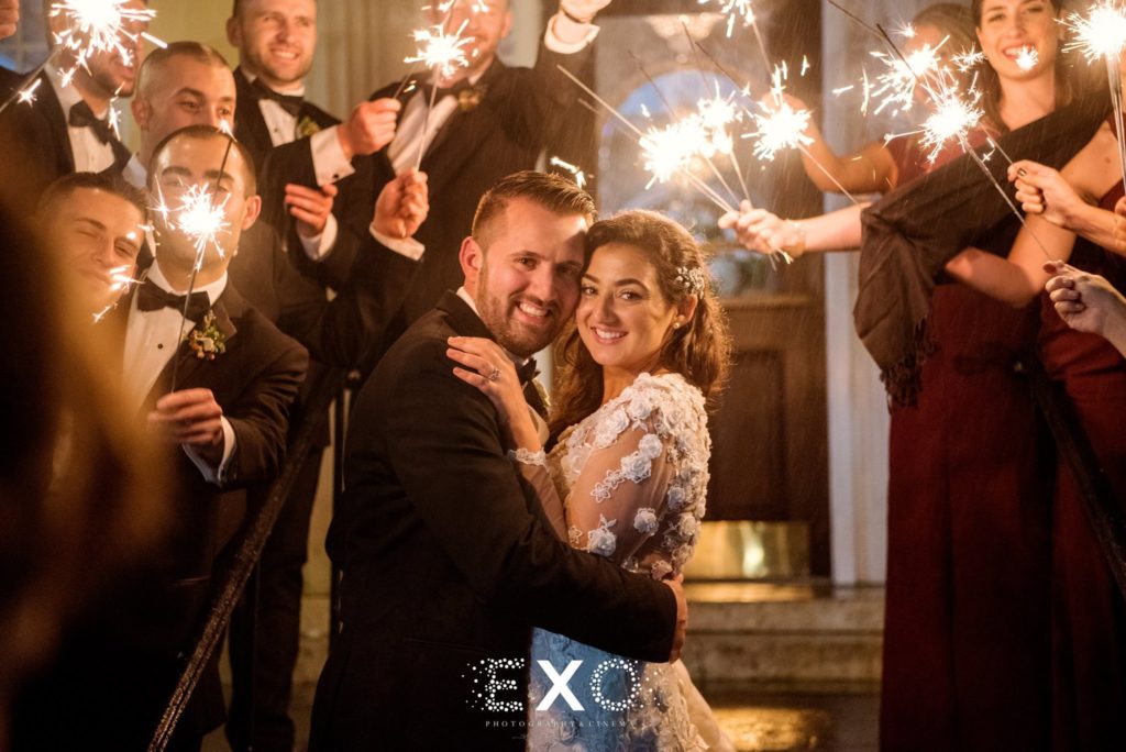 bride and groom with sparkler send off at The Mansion at Oyster Bay