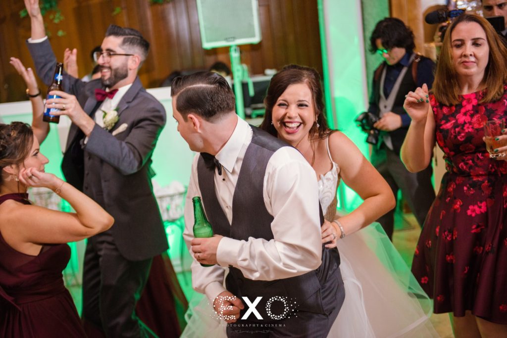 Silly bride and groom dancing at Fox Hollow