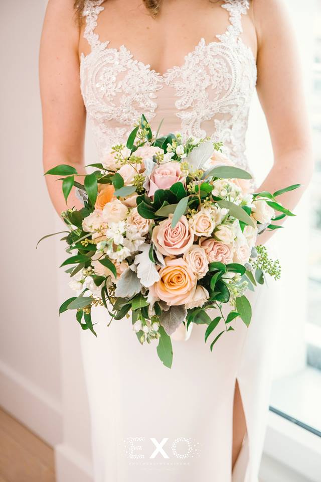 bride with stunning bouquet and wedding gown