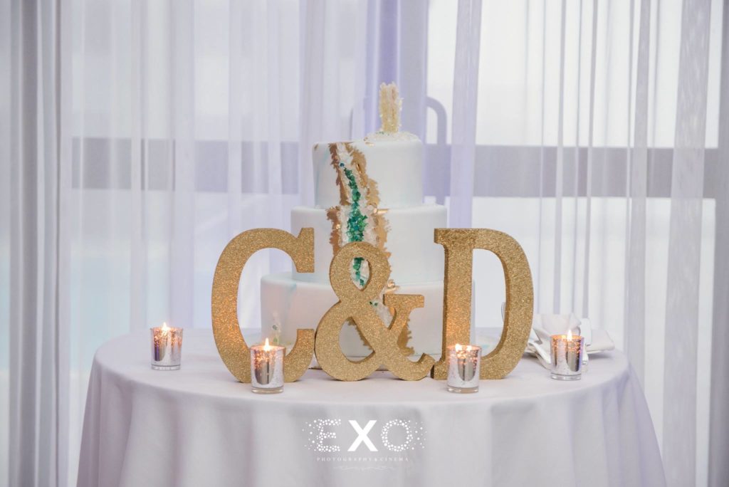 wedding cake with C&D sign at Allegria Hotel