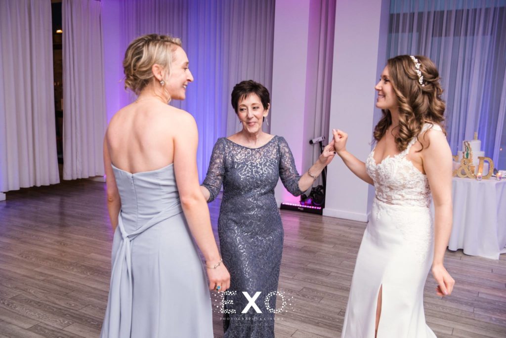 bride dancing with guests at Allegria Hotel