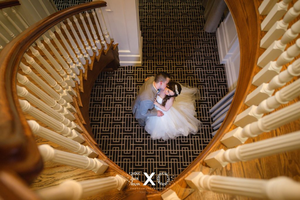 bride and groom below stairs at Bridgeview Yacht Club