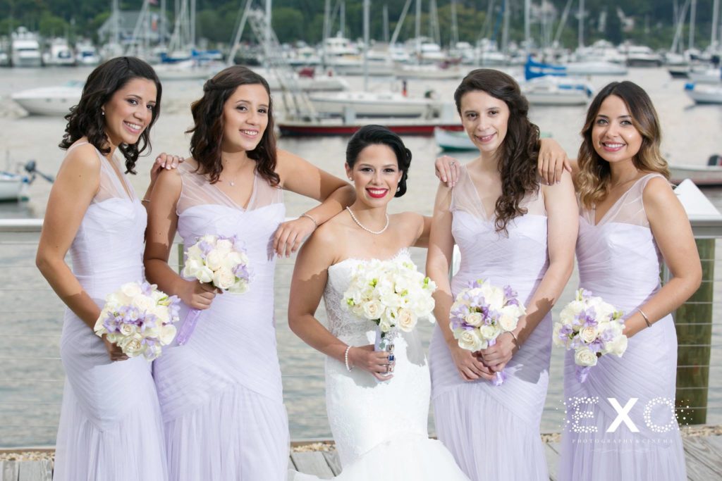 bride and bridesmaids outside Harbor Club at Prime