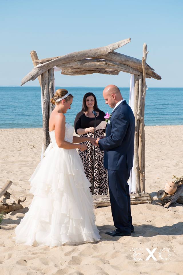 bride and groom exchanging vows at Pavilion at Sunken Meadow