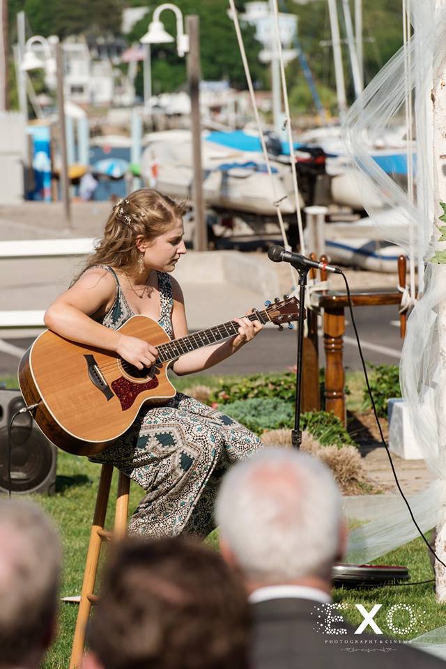 bridesmaid singing a song at Centerport Yacht Club