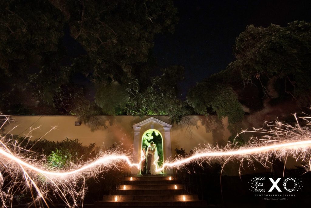 bride and groom in archway at The Mansion at Oyster Bay