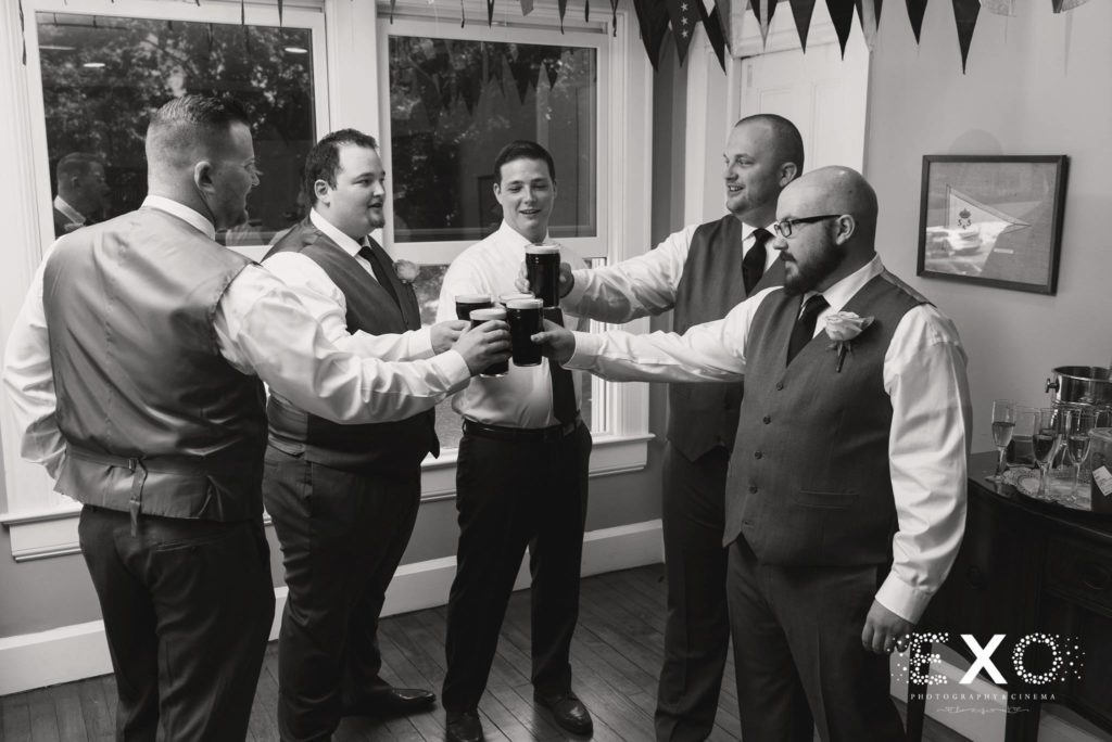 groomsmen toasting the day at Centerport Yacht Club