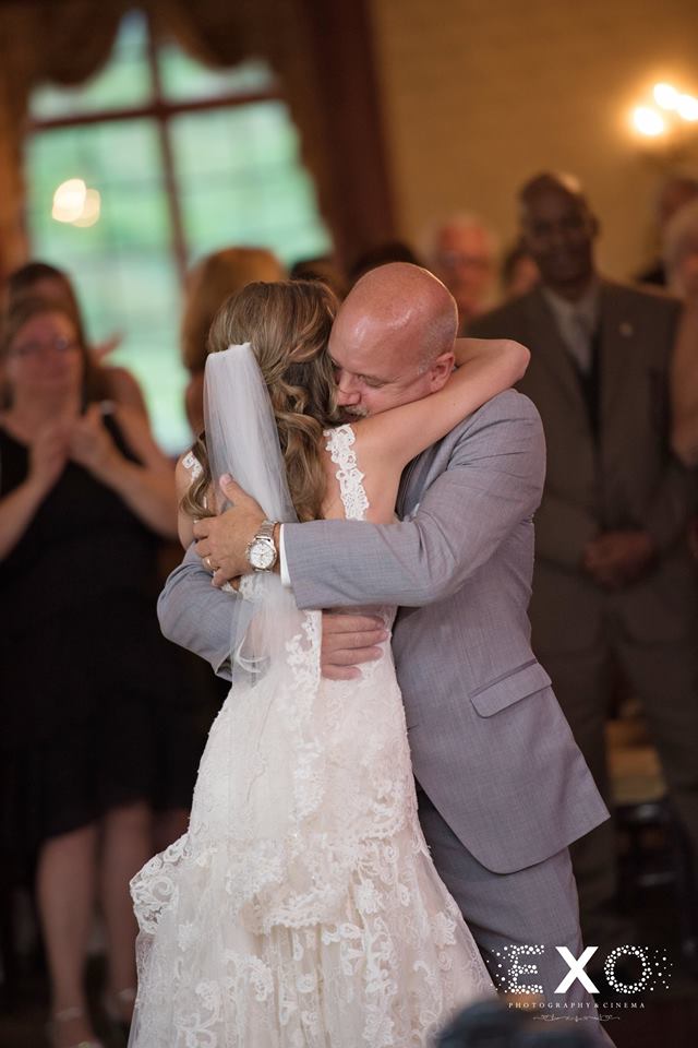bride and father hugging at The Mansion at Oyster Bay