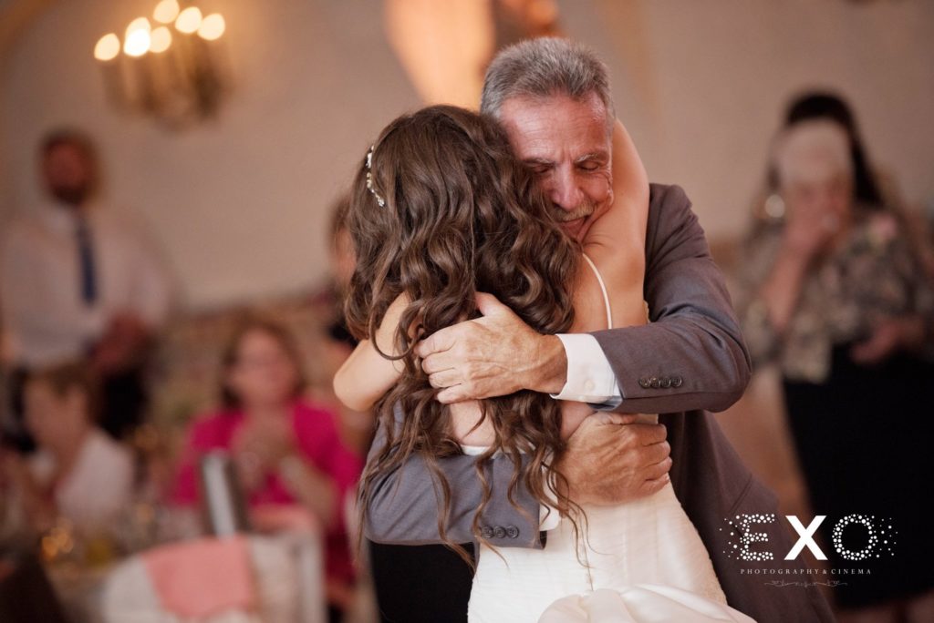 bride and father hugging