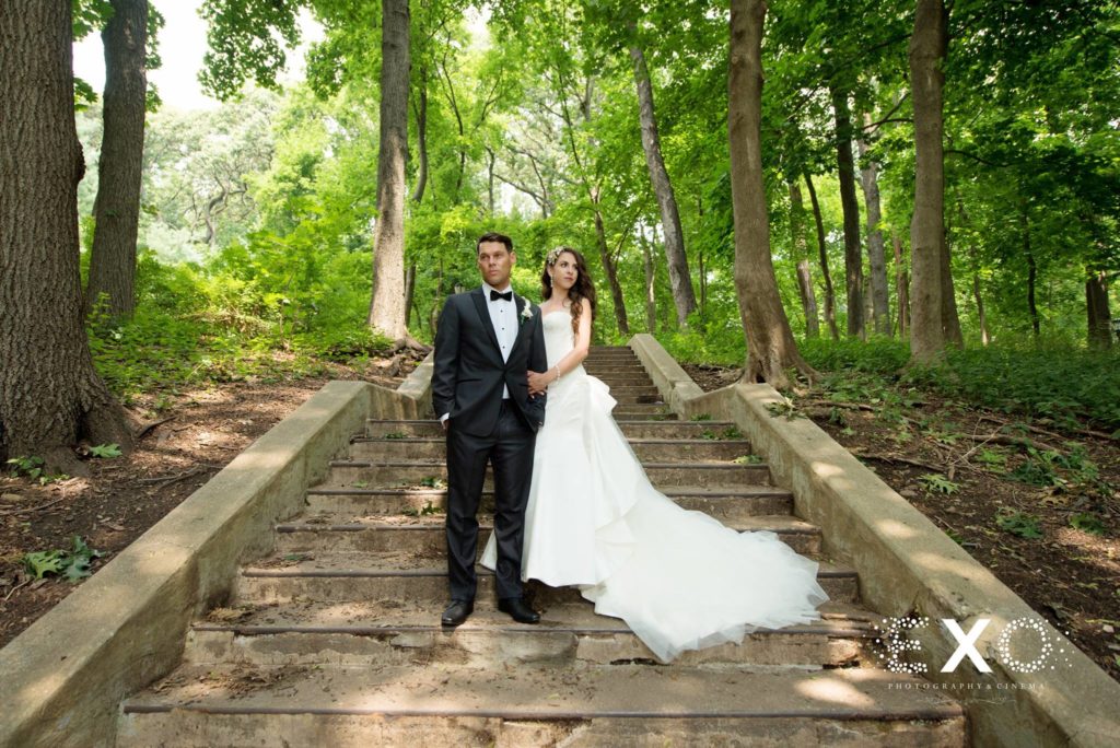 bride and groom on steps at Villa Russo