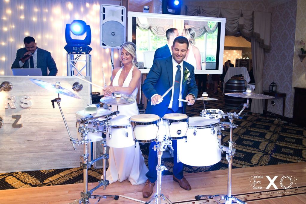 bride and groom playing the drums